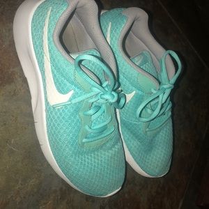 Turquoise Nike running shoes